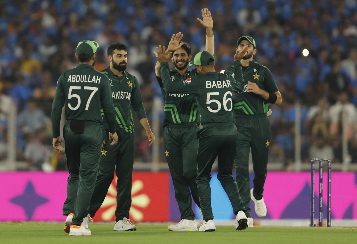 Babar Azam celebrates with his Pakistan teammates after the fall of a wicket