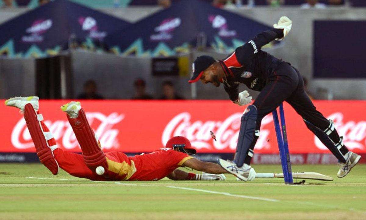 Pargat Singh is run-out by USA wicketkeeper Monak Patel.