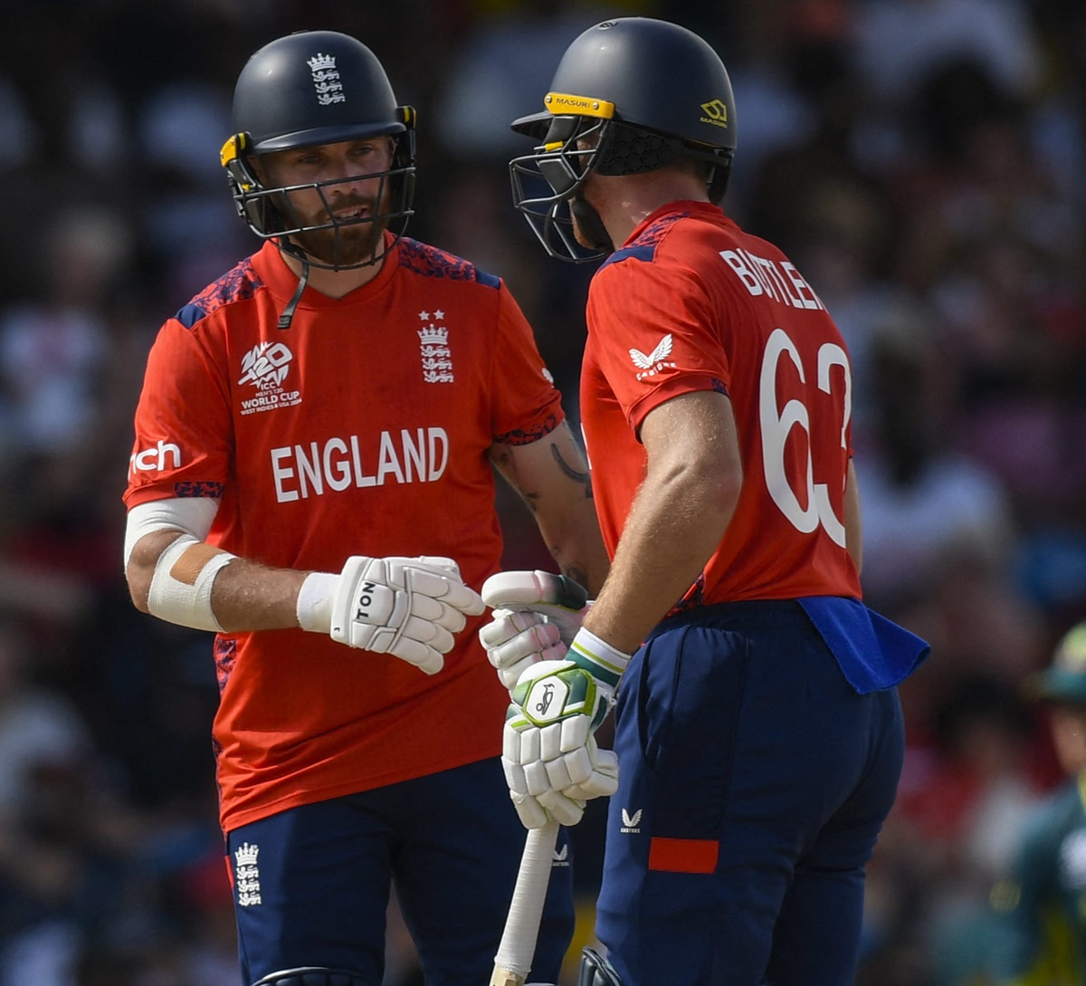 Jos Buttler and Phil Salt celebrate a boundary during their opening partnership.
