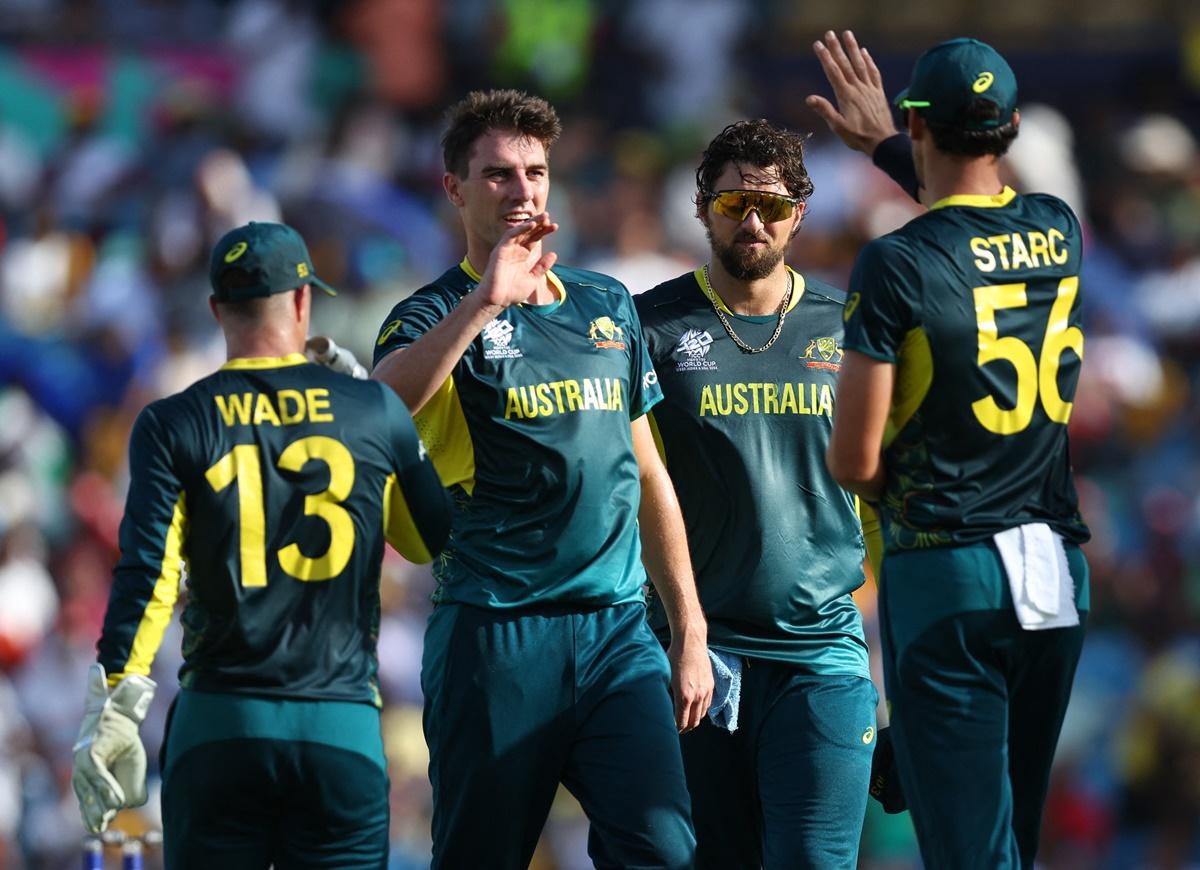 Australia's Pat Cummins celebrates with teammates after taking the wicket of England's Liam Livingstone during the T20 World Cup Group B match against England at Kensington Oval, Bridgetown, Barbados, on Saturday.