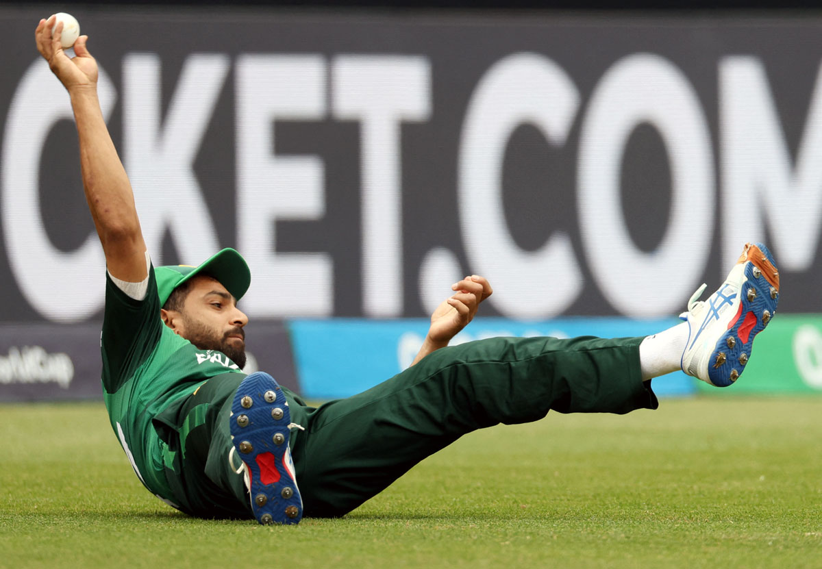 Haris Rauf takes the catch to dismiss Rohit Sharma off the bowling of Shaheen Shah Afridi.