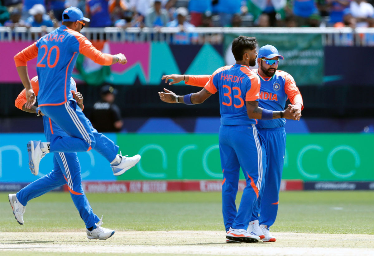 Hardik Pandya celebrates with team-mates after taking the wicket of Fakhar Zaman. 