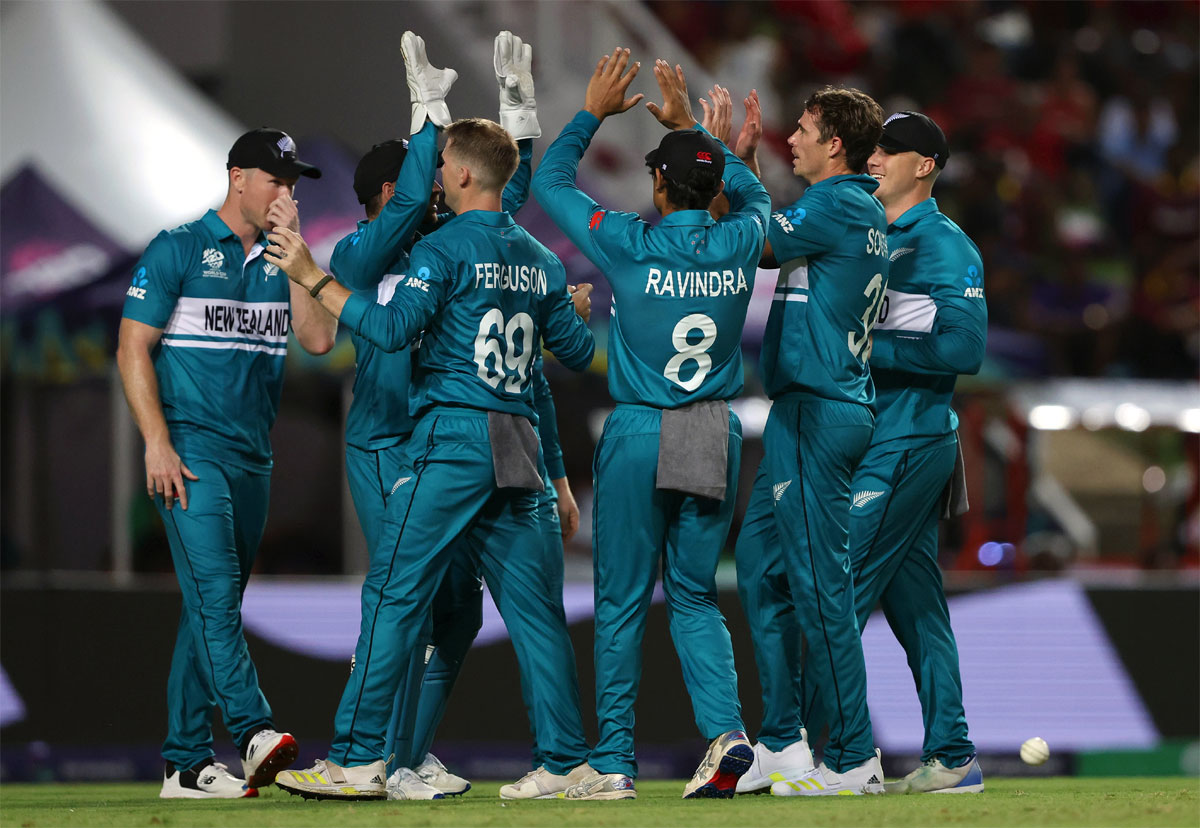 New Zealand's players celebrate a West Indies wicket.