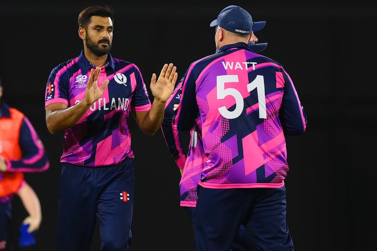 Scotland's Safyaan Sharif celebrates the wicket of Australia's Mitchell Marsh. 