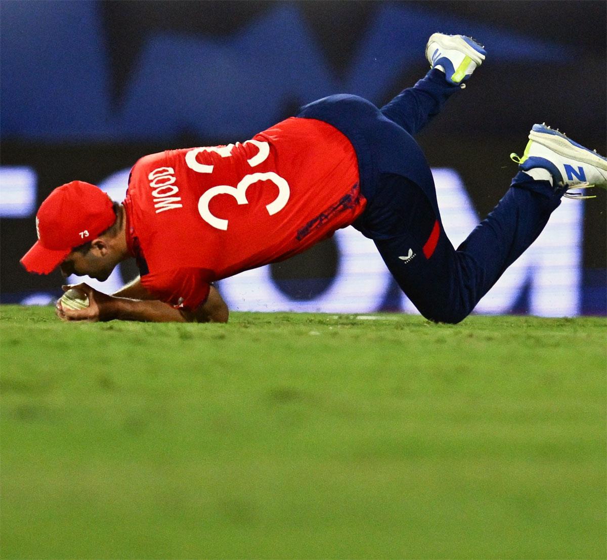 Mark Wood takes the catch to dismiss Rovman Powell off the bowling of Liam Livingstone. 