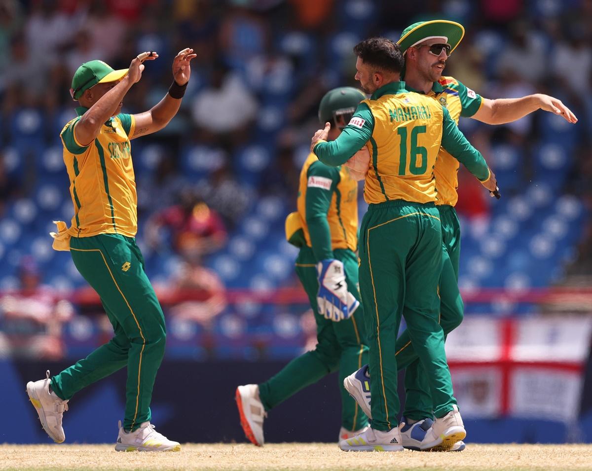 Keshav Maharaj celebrates with his South Africa temmates after dismissing Jos Buttler