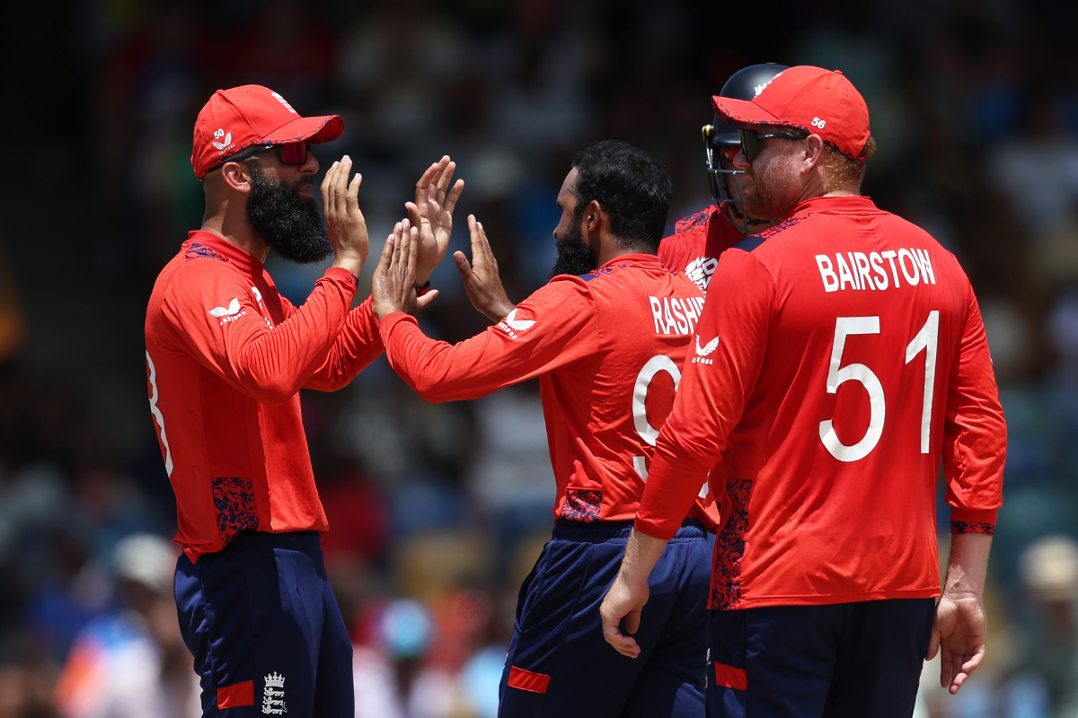 Adil Rashid celebrates the wicket of Aaron Jones