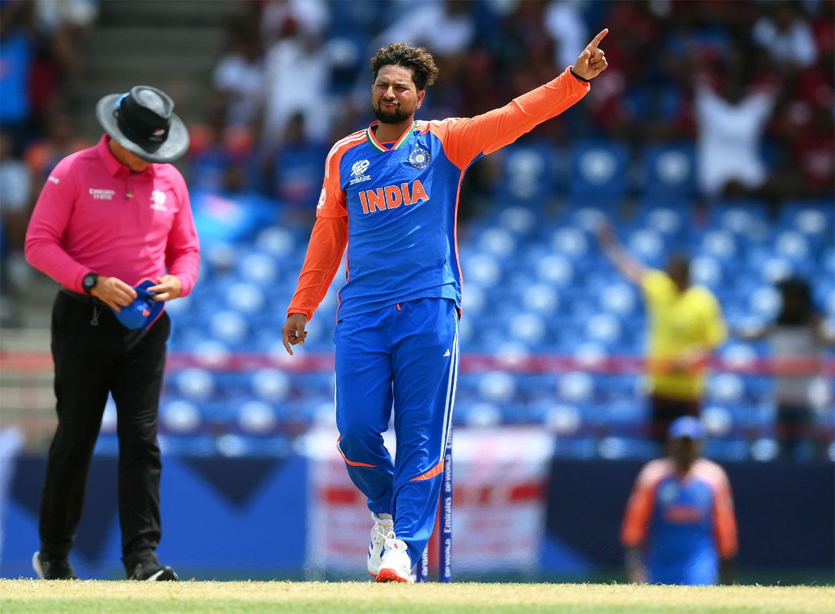 Kuldeep Yadav celebrates after dismissing Glenn Maxwell.