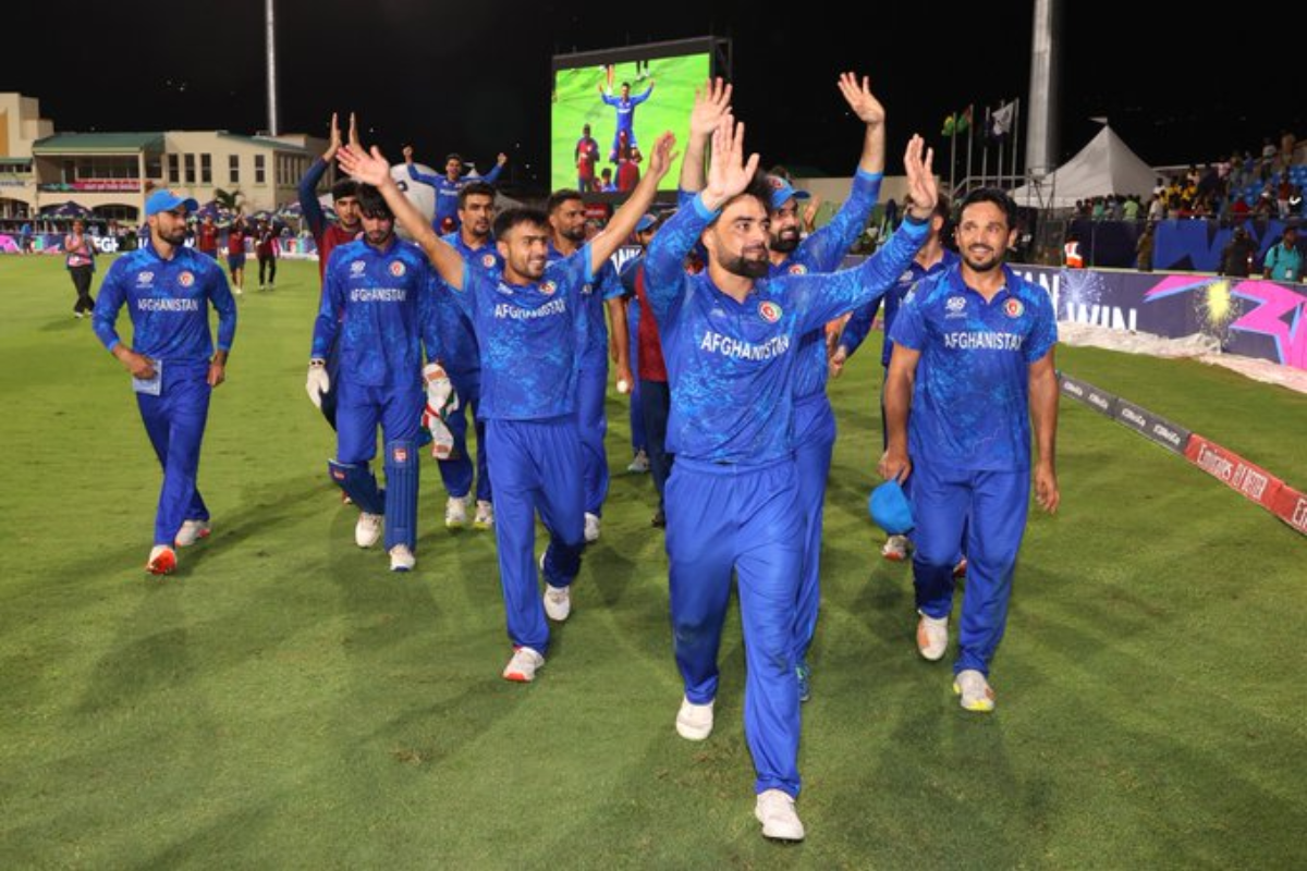 Rashid Khan leads Afghanistan players in celebration after their win over Bangladesh helped them book a spot in the T20 WC semis