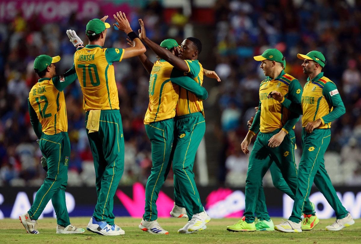 Kagiso Rabada celebrates with teammates after taking the wicket of Ibrahim Zadran 