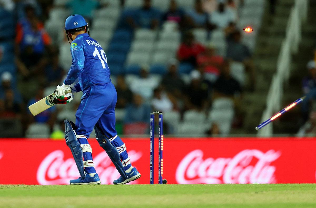 Afghanistan captain Rashid Khan is bowled out by Anrich Nortje 