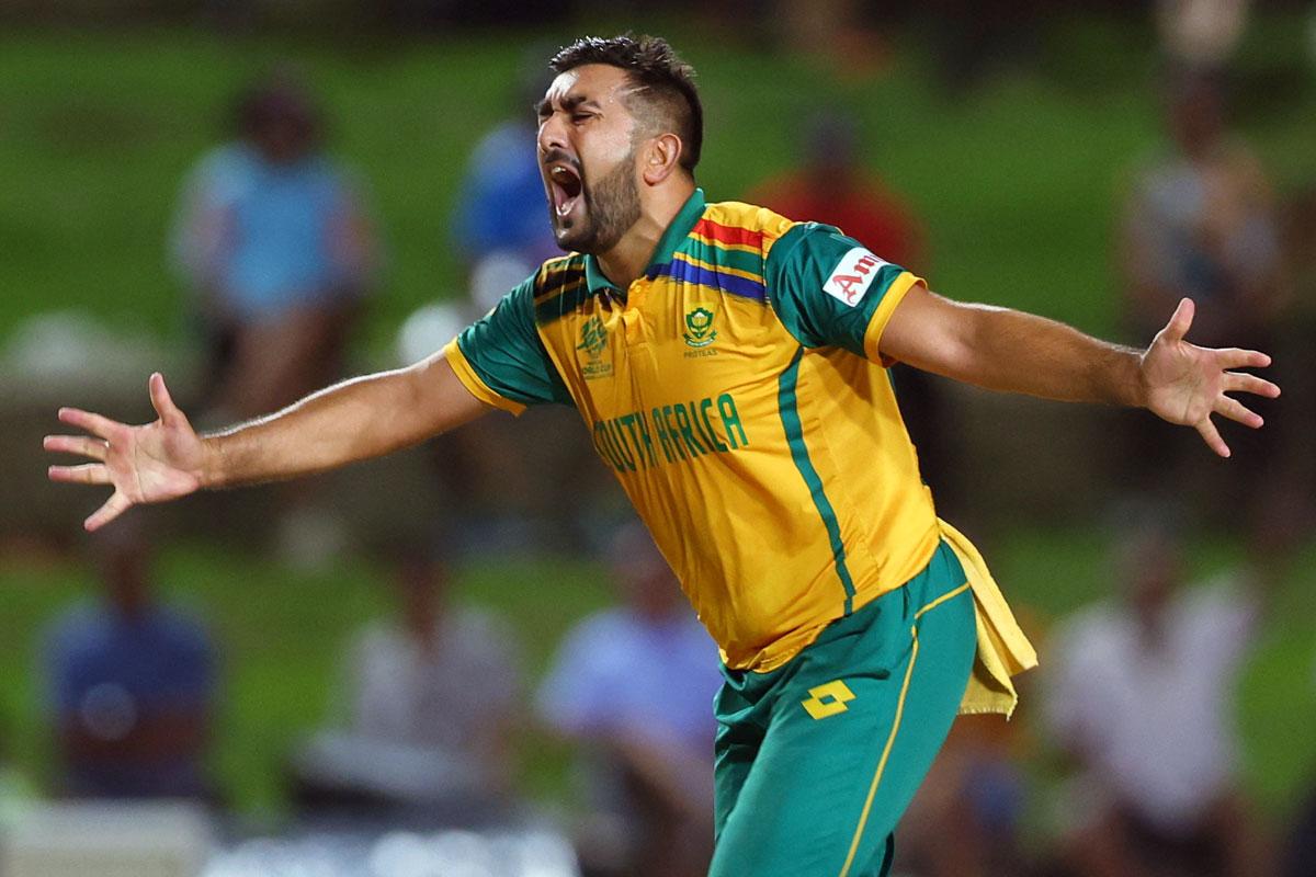 Tabraiz Shamsi celebrates the wicket of Noor Ahmad.