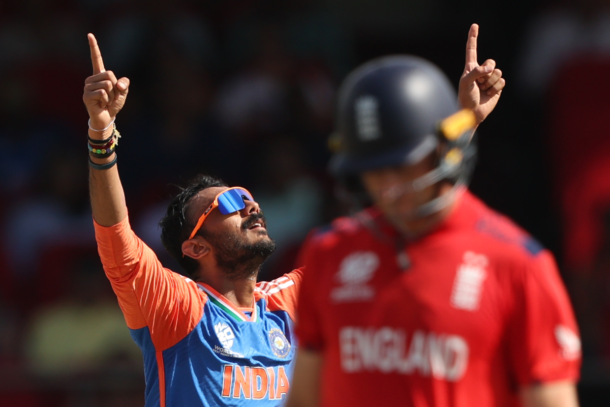 Axar Patel celebrates after taking out Jos Buttler