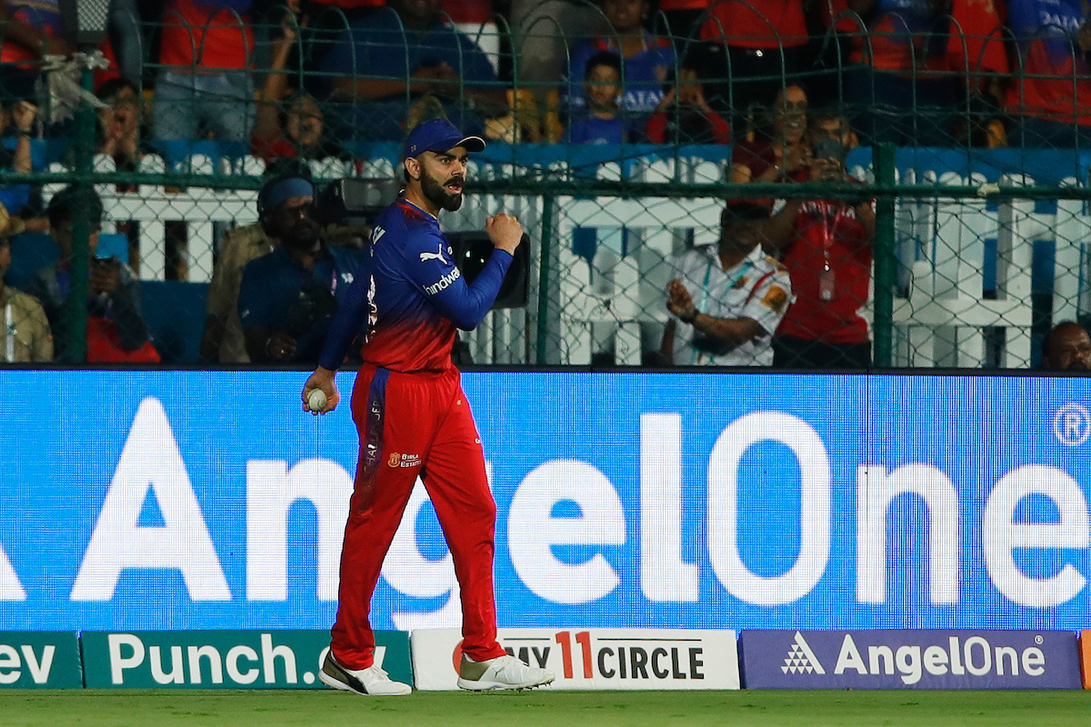 Royal Challengers Bengaluru's Virat Kohli celebrates after taking a catch to dismiss Punjab Kings' Shikhar Dhawan 