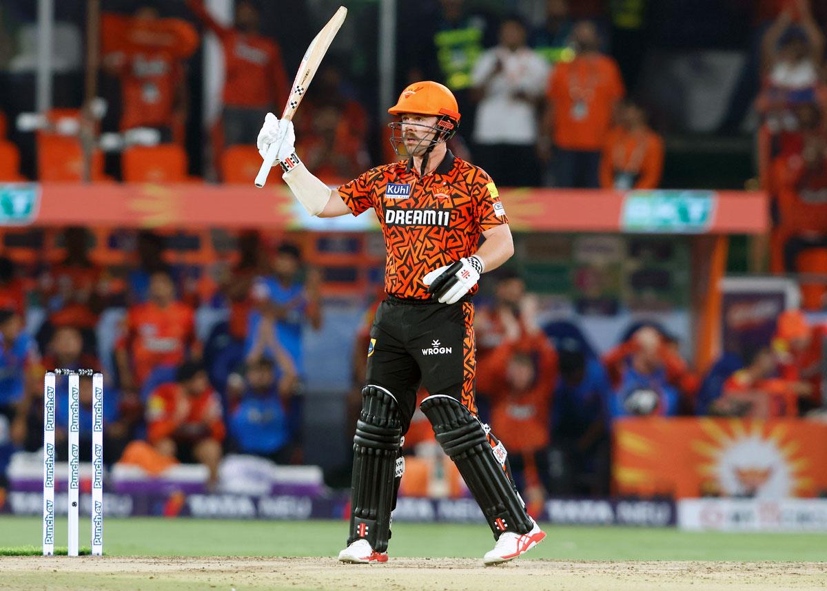 Travis Head celebrates on reaching his half-century off 18 balls