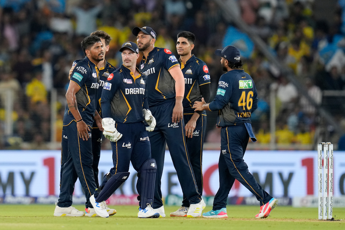 Umesh Yadav celebrates with his Gujarat Titans teammates after dismissing Chennai Super Kings skipper Ruturaj Gaikwad during the IPL match at the Narendra Modi Stadium, in Ahmedabad, on Friday.