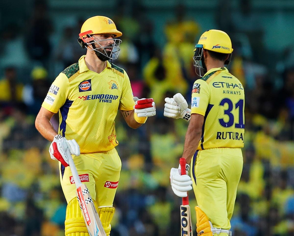 Daryl Mitchell and Ruturaj Gaikwad celebrate a six.