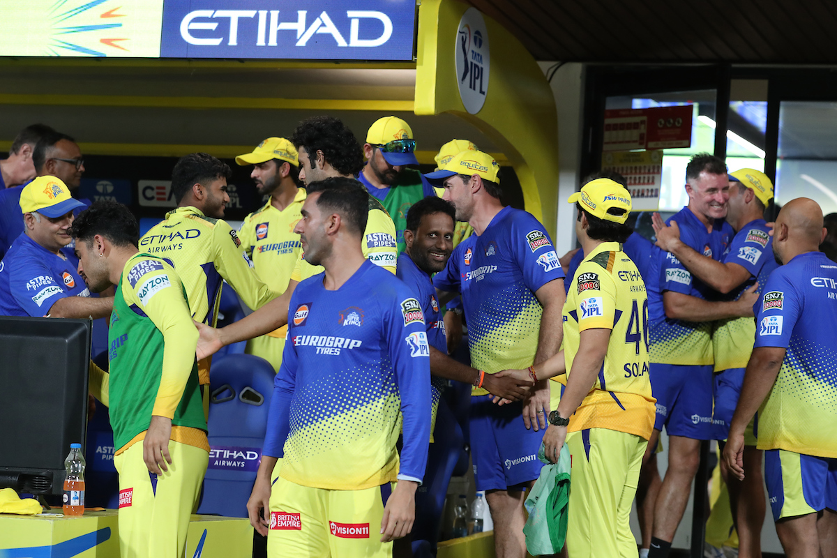 Chennai Super Kings players and staff celebrate victory over Rajasthan Royals in the IPL match at the M A Chidambaram Stadium, in Chennai, on Sunday.