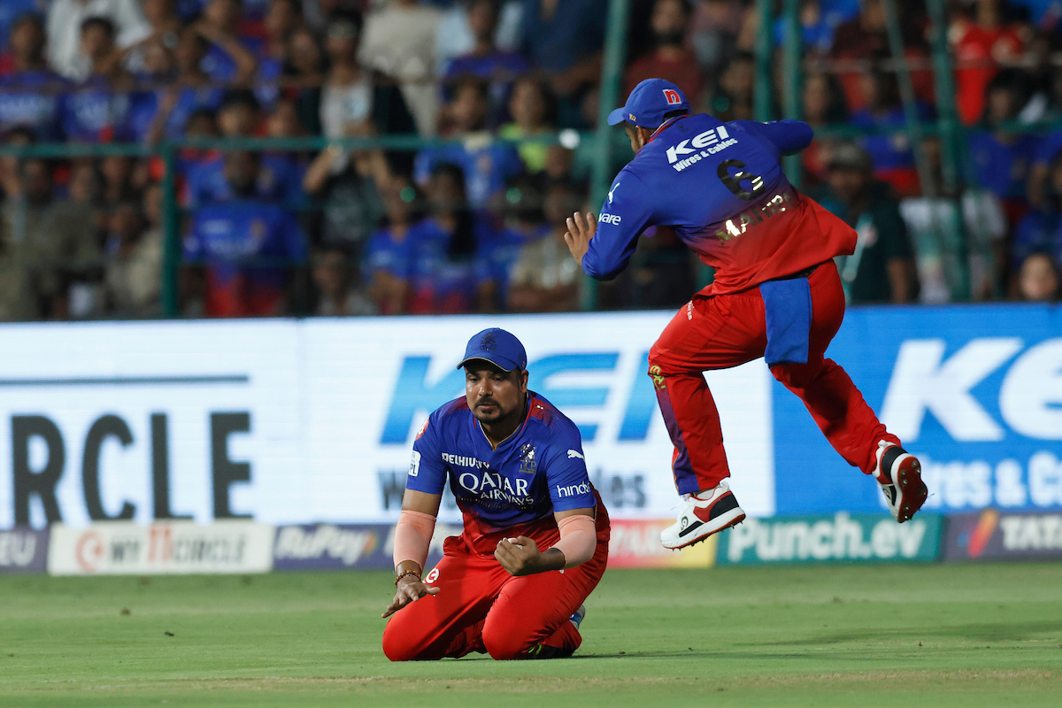 Karn Sharma takes the catch to dismiss Shai Hope. 