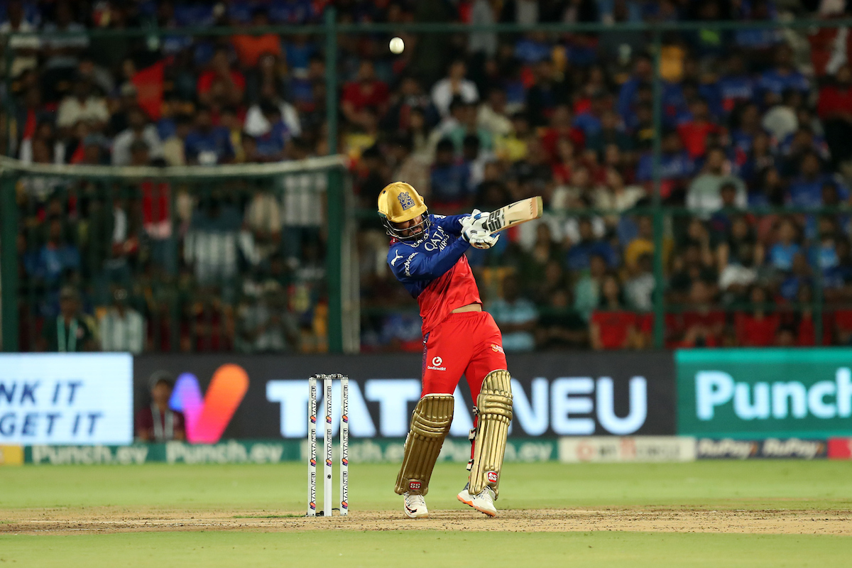 Royal Challengers Bengaluru's Rajat Patidar hits a four during his 52 off 32 balls against Delhi Capitals in the IPL match in Bengaluru on Sunday