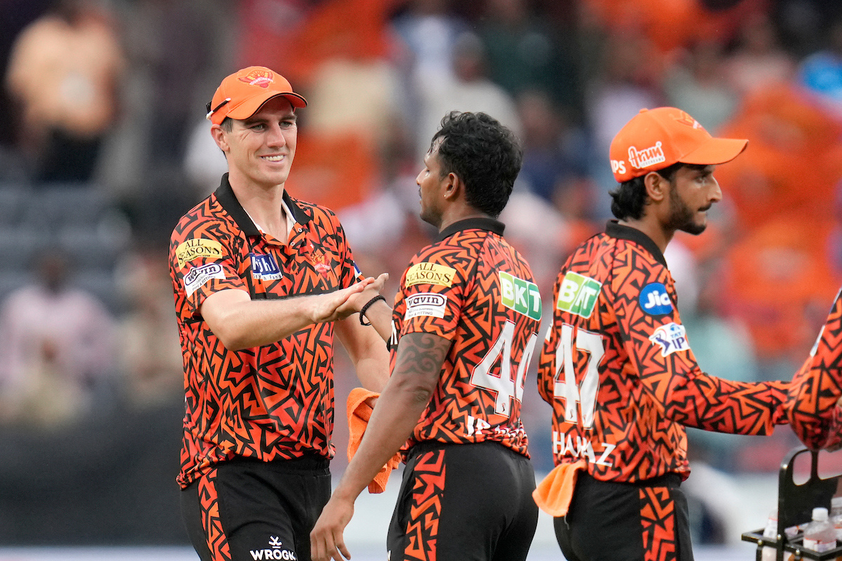 T. Natarajan celebrates with skipper Pat Cummins after dismissing Atharva Taide.