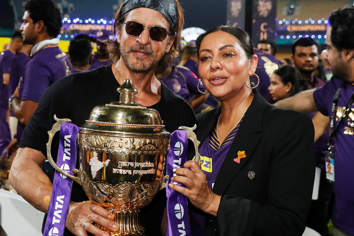 Owners of theKolkata Knight Riders, Shah Rukh Khan and wife Gauri Khan celebrate with the trophy after KKR won their third IPL title on Sunday