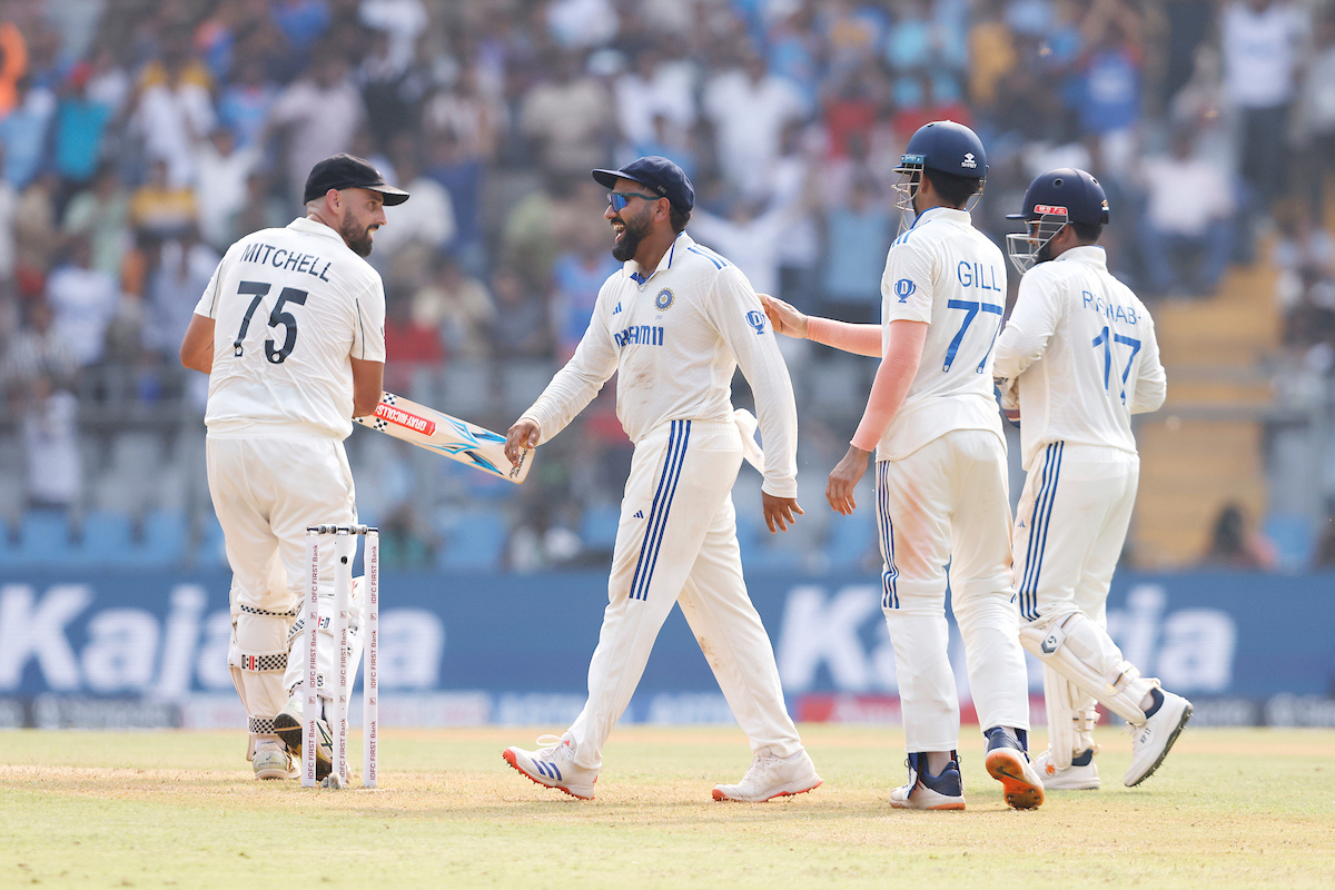 Indian players celebrates the wicket of Daryl Mitchell