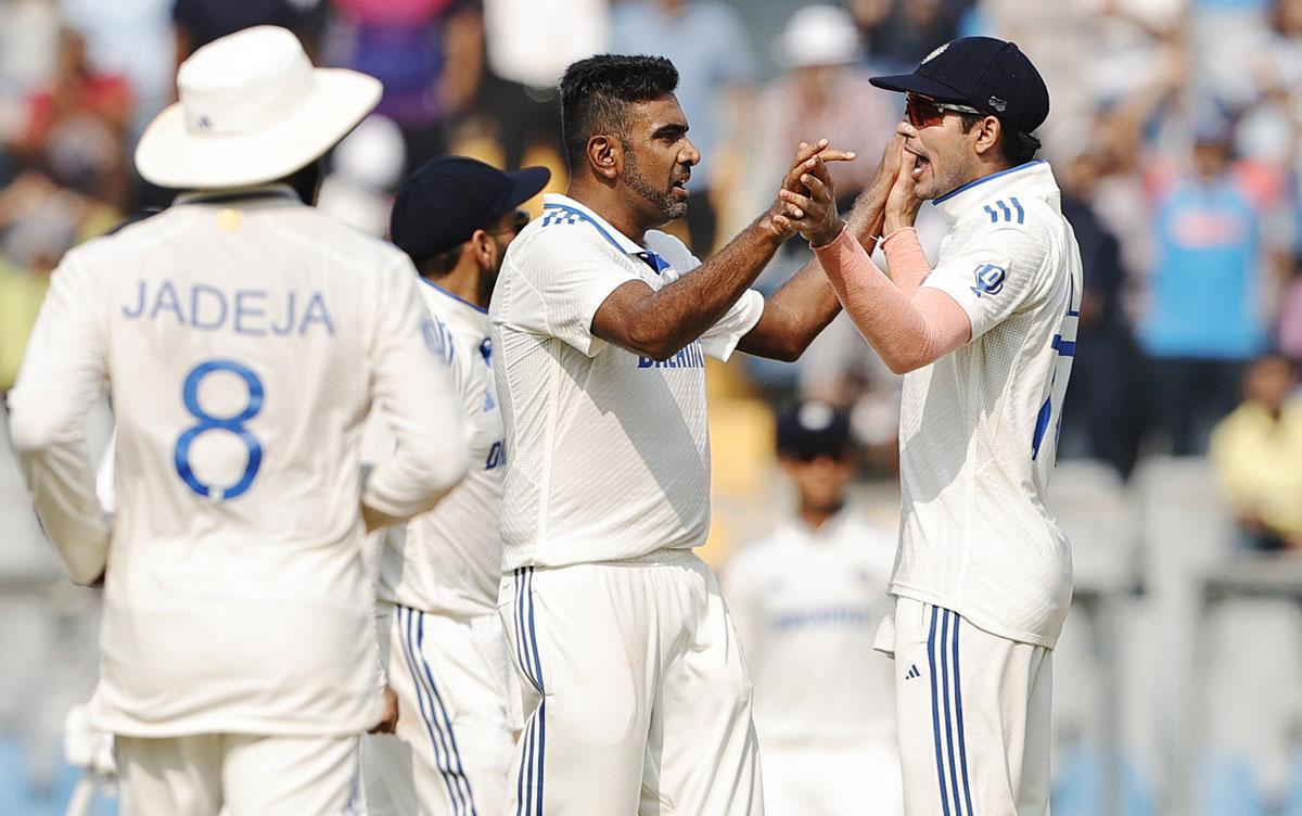 Ravichandran Ashwin celebrates after taking the wicket of Rachin Ravindra