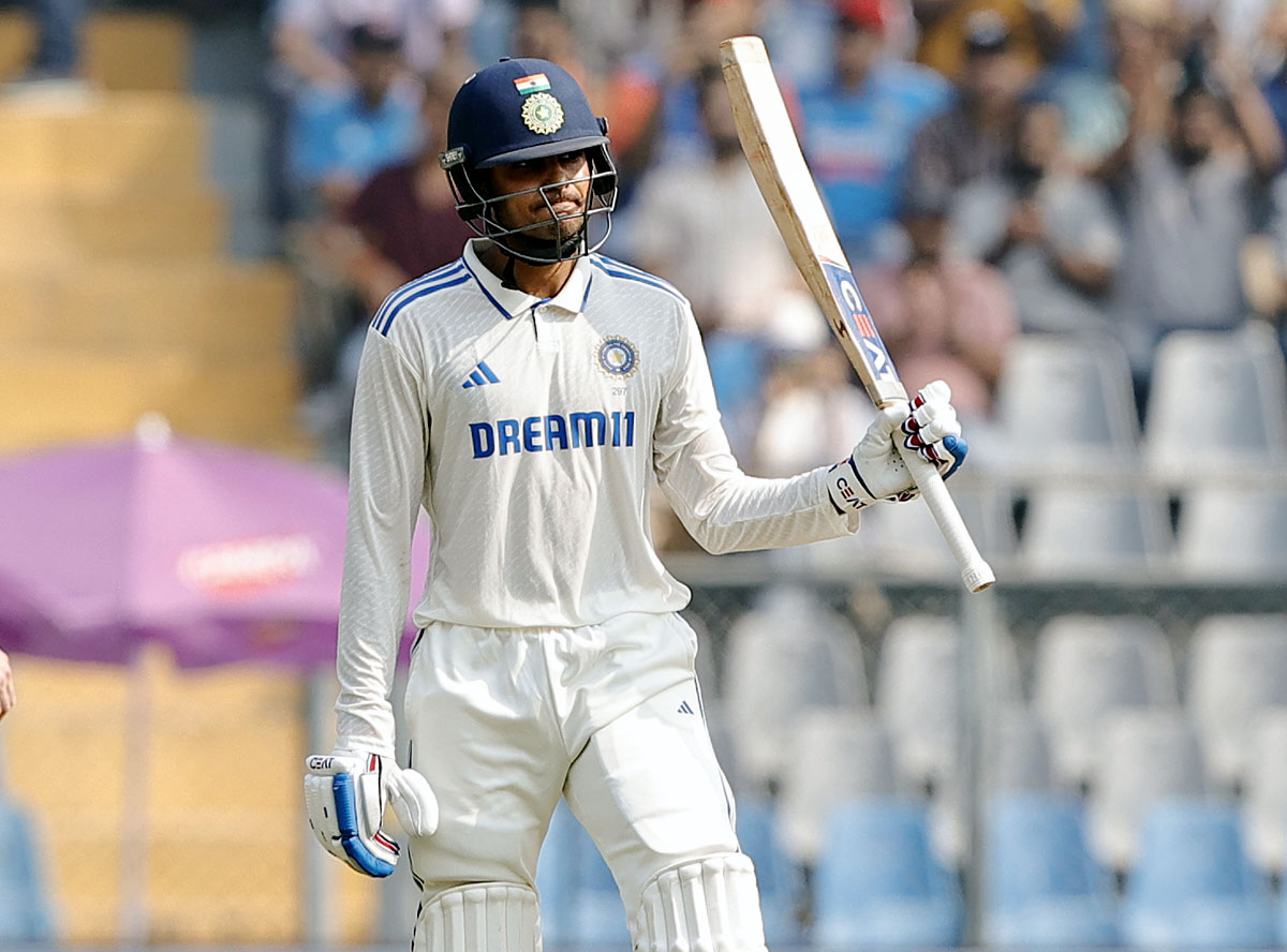 Shubman Gill celebrates his half-century.