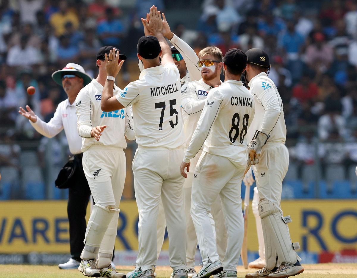 New Zealand players celebrates the wicket of Ravindra Jadeja, who was dismissed by Glen Phillips.