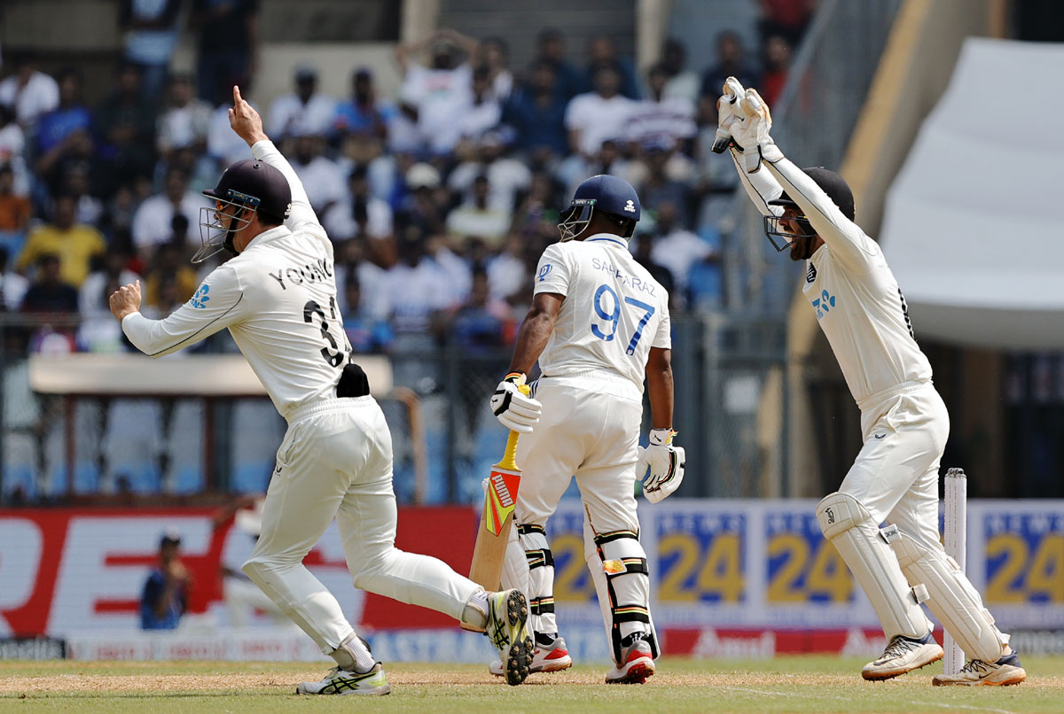 Wicketkeeper Tom Blundell appeals after taking the catch to dismiss Sarfaraz Khan off the bowling of Ajaz Patel.