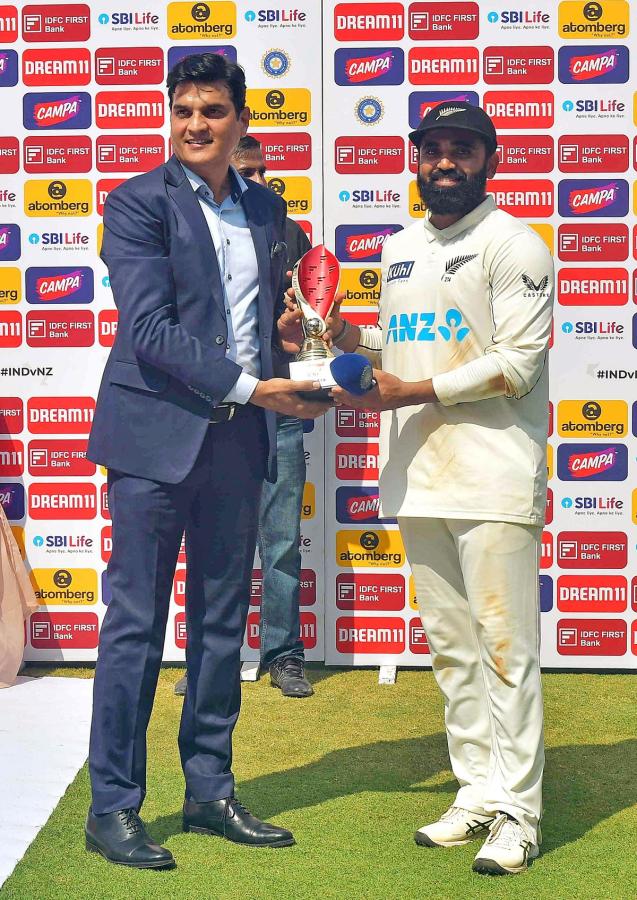 New Zealand's Ajaz Patel being felicitated with the 'Player of the Match' trophy after the team won the third test match against India by 25 runs, at Wankhede Stadium in Mumbai