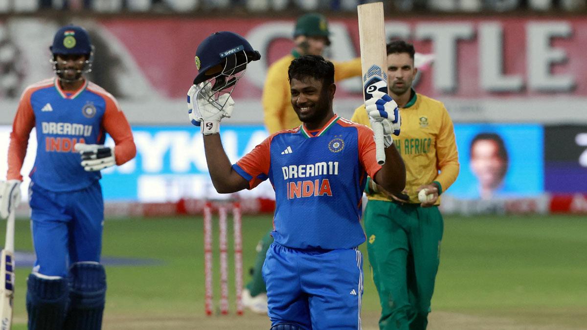 Sanju Samson celebrates after completing his century