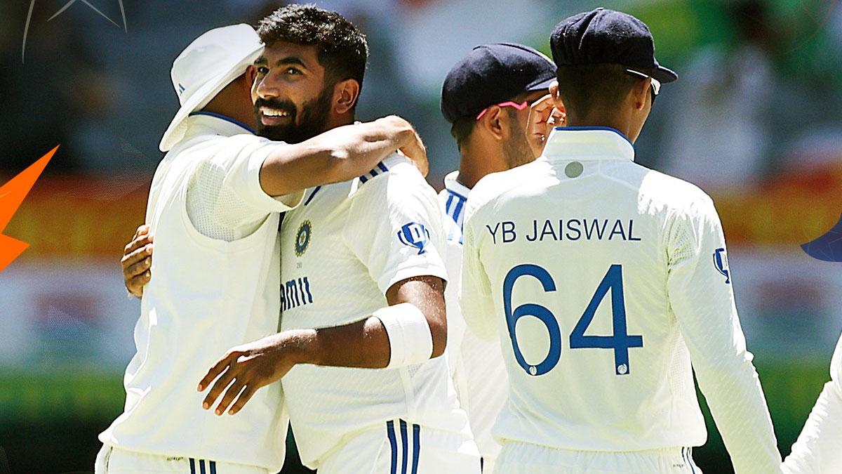 India pacer Jasprit Bumrah celebrates with teammates after taking the wicket of Alex Carey.