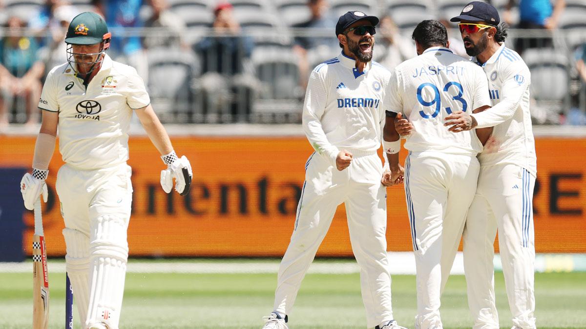 India's players celebrate after Jasprit Bumrah dismisses Travis Head.