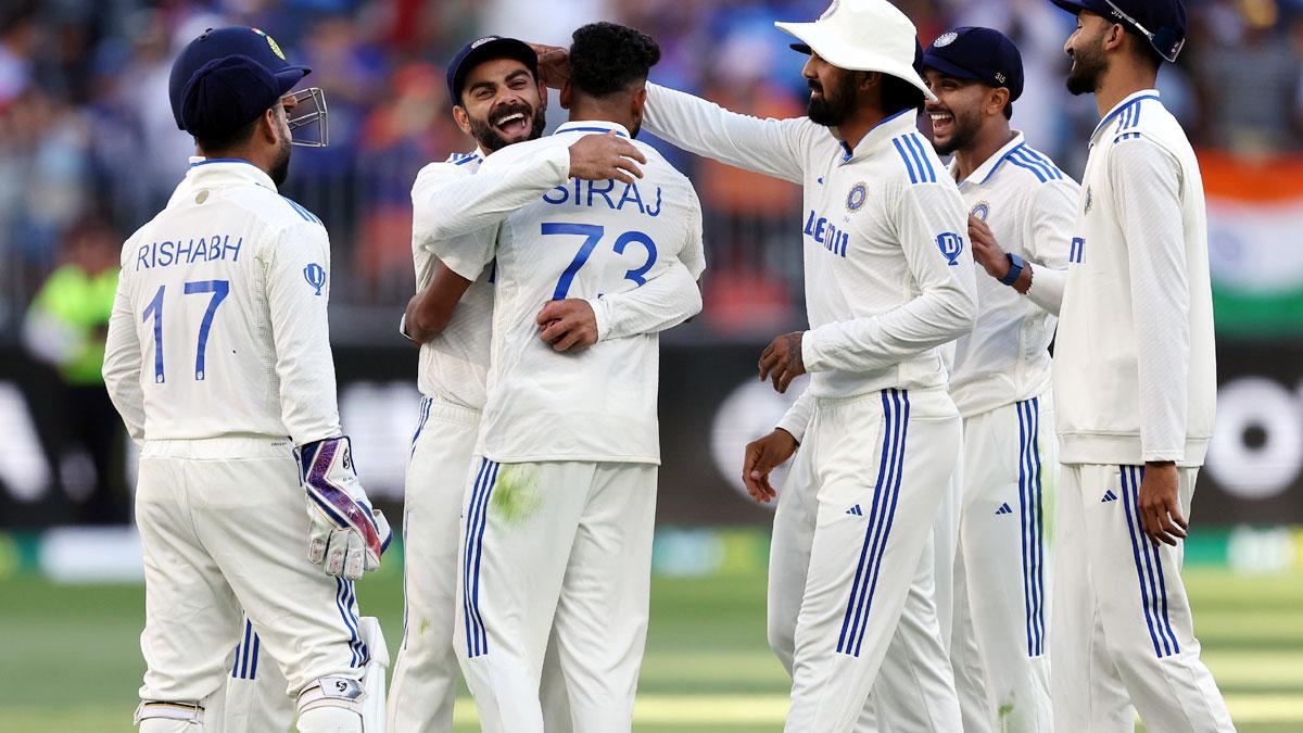 India's players celebrate after Mohammed Siraj dismisses Usman Khawaja.