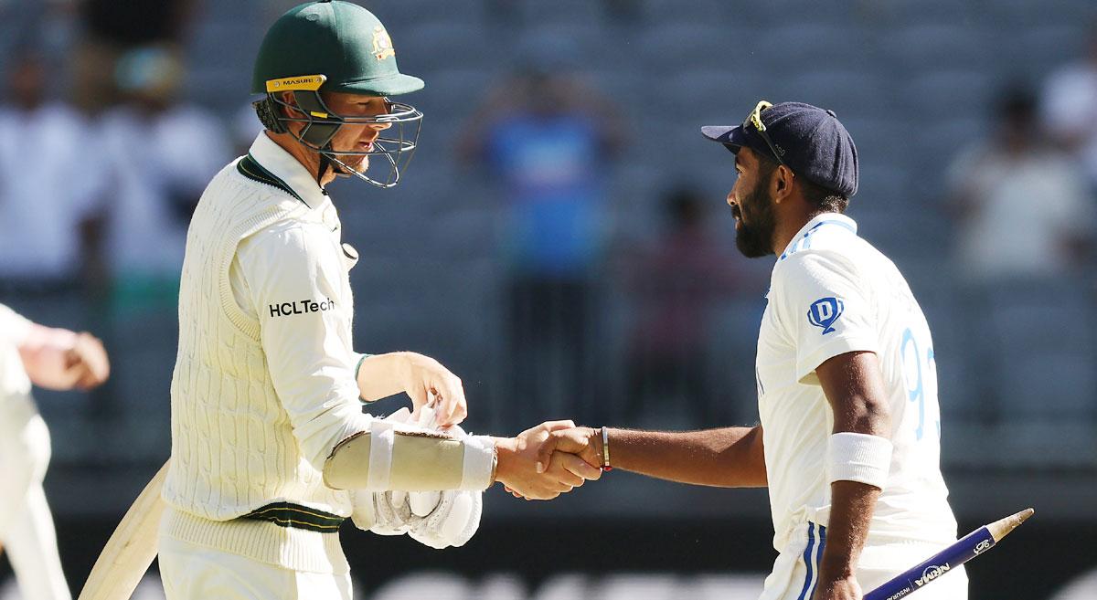 Australia's Josh Hazlewood congratulates India's captain Jasprit Bumrah on the resounding victory in the first Test in Perth on Monday.