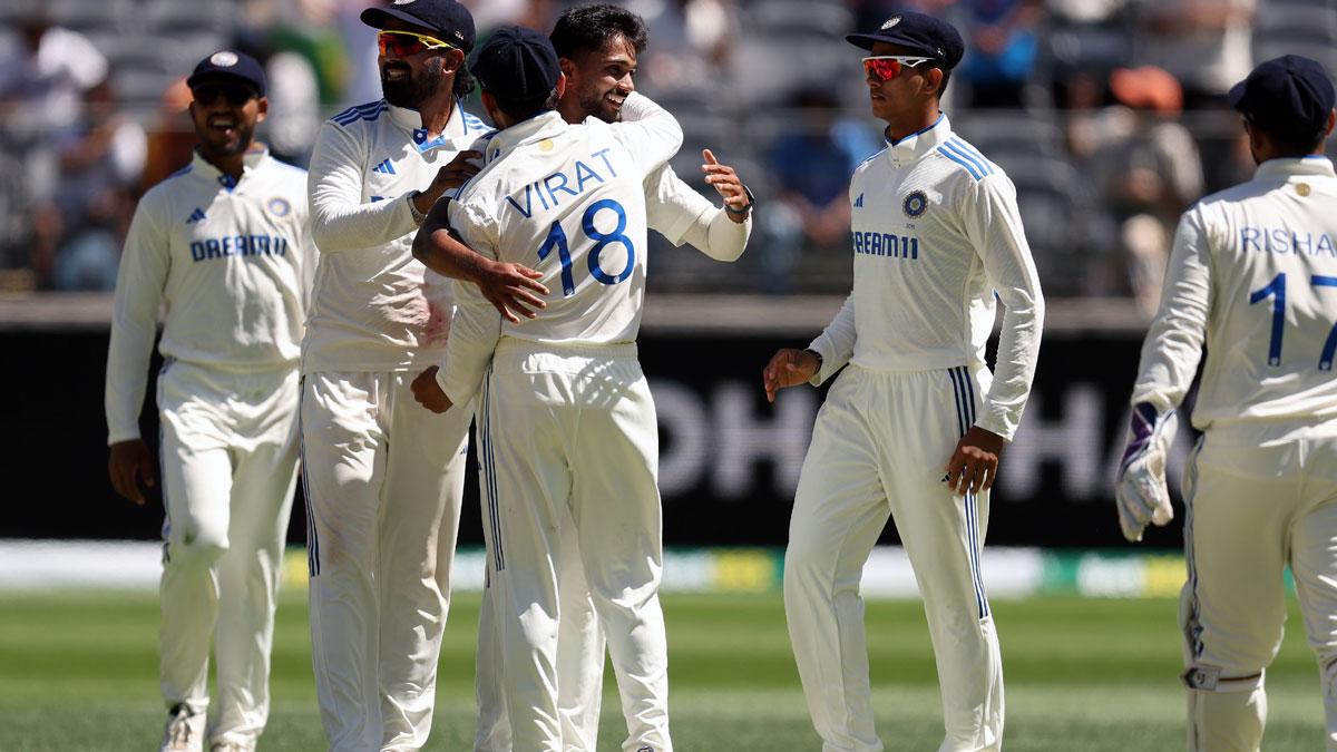 Nitish Reddy celebrates with teammates after taking the wicket of Mitchell Marsh.