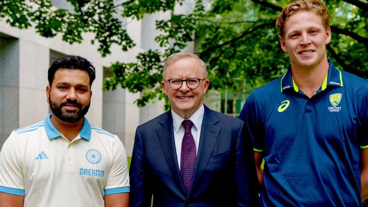 Australian Prime Minister Anthony Albanese is flanked by Indian Test captain Rohit Sharna and Australian PM's XI captain at a reception in Canberra on Thursday