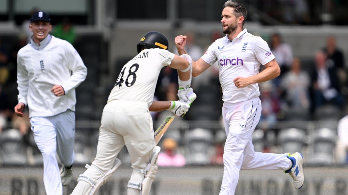 Chris Woakes celebrates the wicket of Tom Latham.