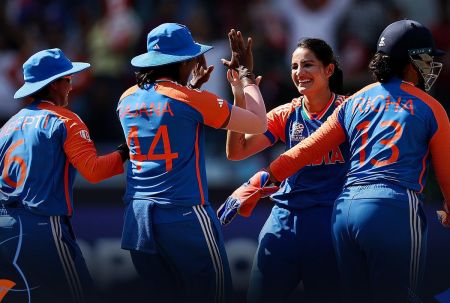 India women's team celebrate a wicket.