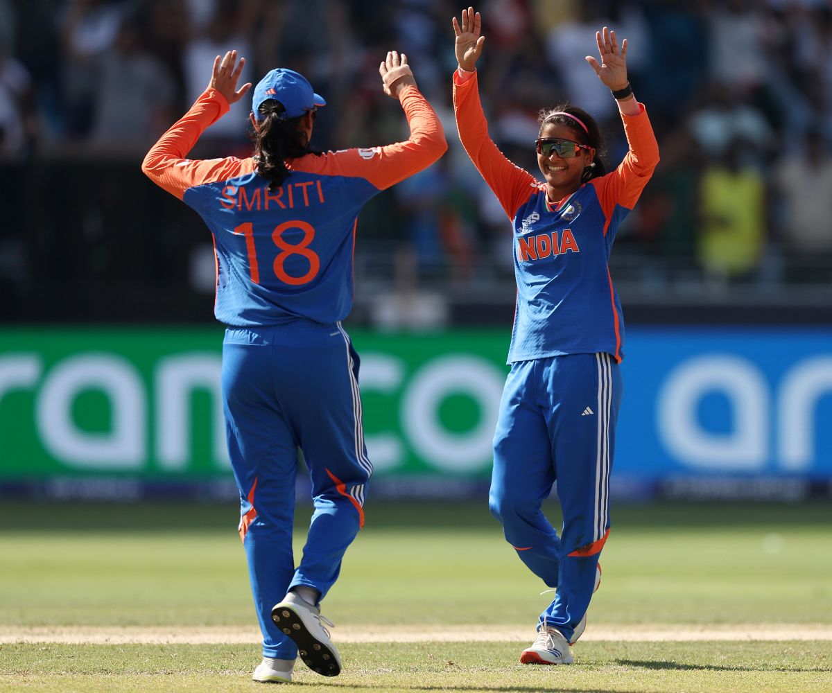 Shreyanka Patil celebrates taking a wicket with teammate Smriti Mandhana.