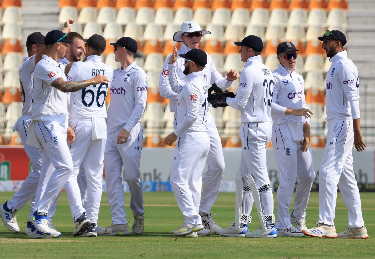 England's players celebrate a wicket