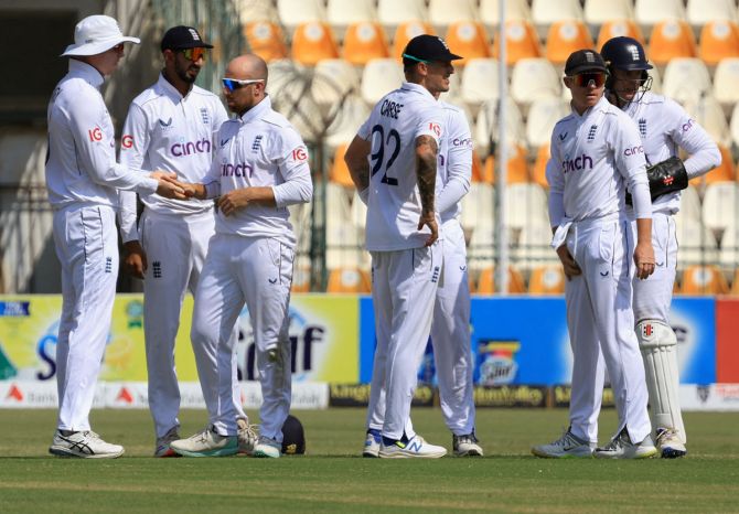 Jack Leach celebrates with teammates after taking the wicket of Salman Agha