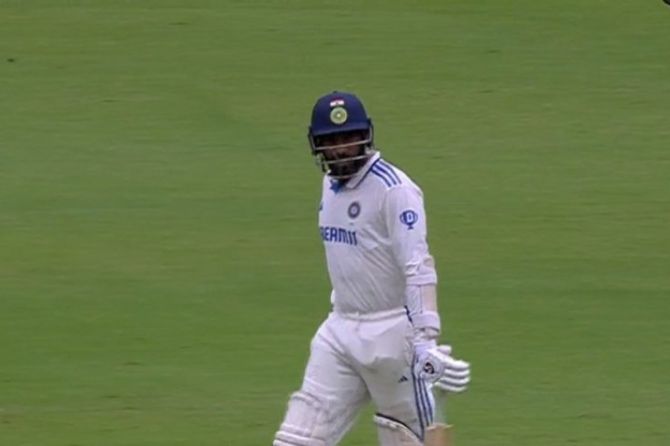 Jasprit Bumrah walks back after his dismissal. 