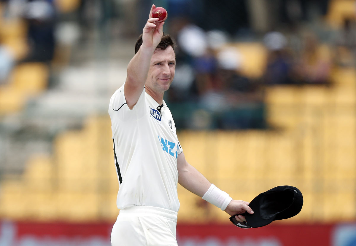 Matt Henry celebrates after taking the wicket of Kuldeep Yadav to complete his five-wicket haul.