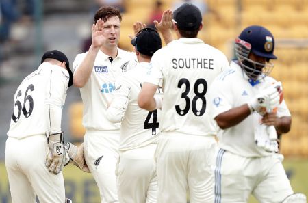 Matt Henry celebrates with team-mates after getting the wicket of Rishabh Pant in the first innings