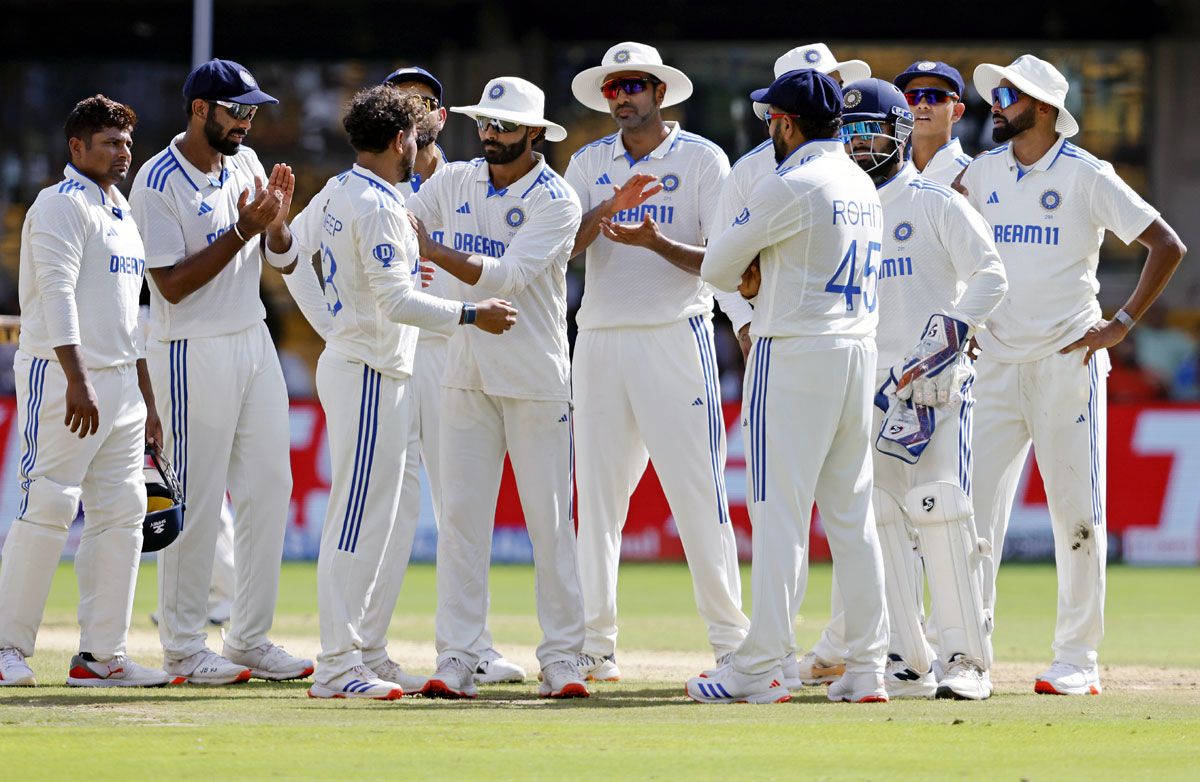 Kuldeep Yadav celebrates the wicket of Tom Latham, who was given out on the review.