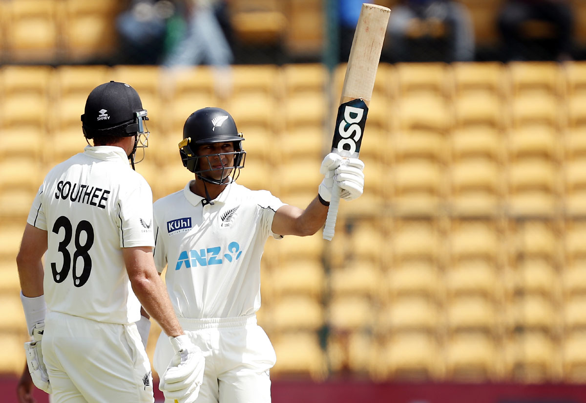 Rachin Ravindra celebrates his half-century.