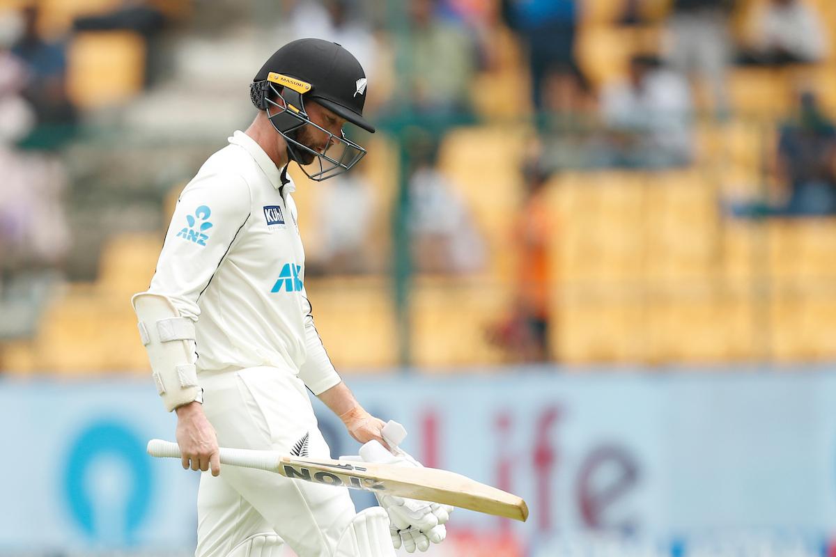 Devon Conway walks back to the pavilion after being trapped LBW by Jasprit Bumrah after India won a review